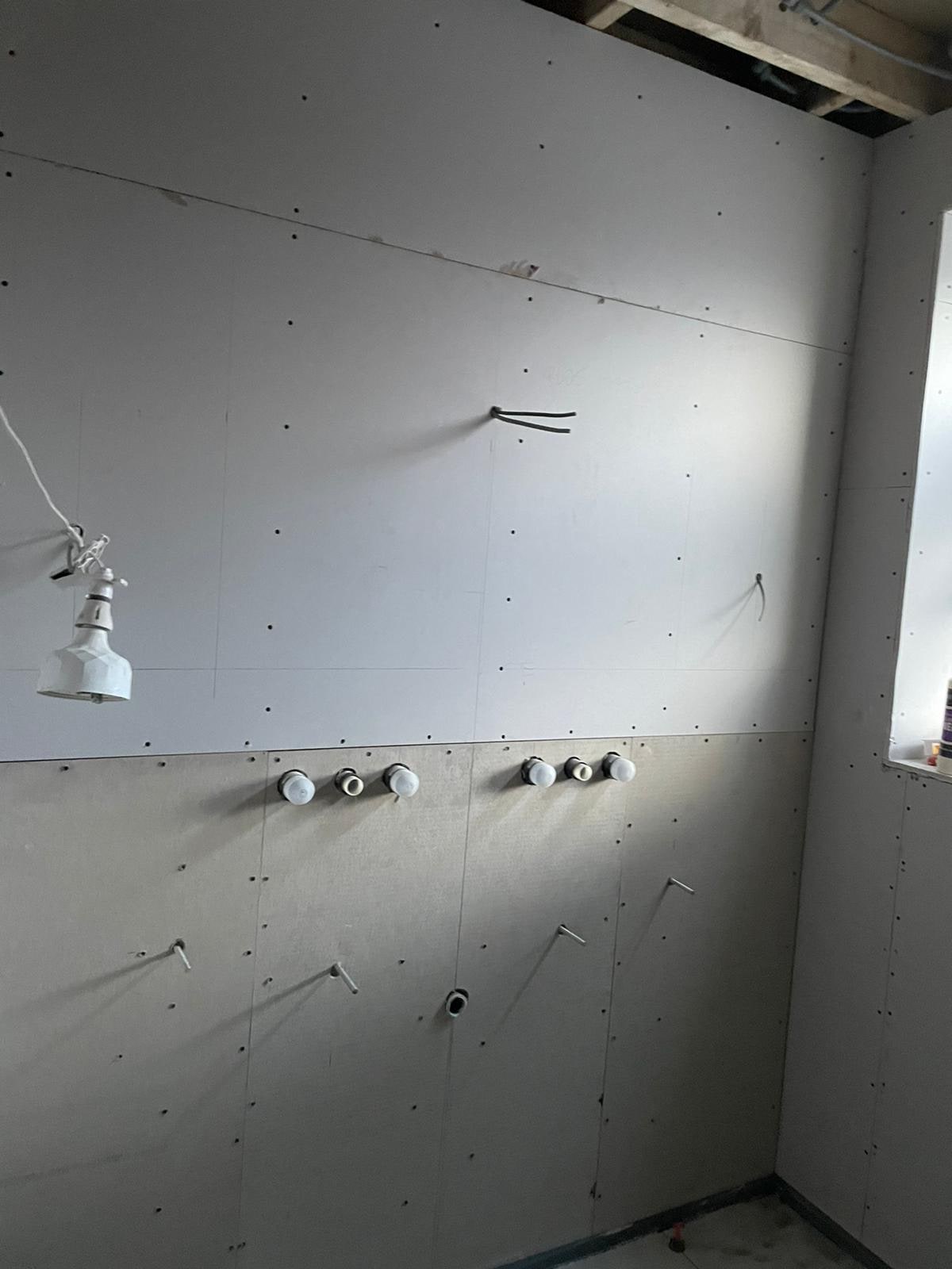 A Period Bathroom Reborn in Stone & Bronze Before