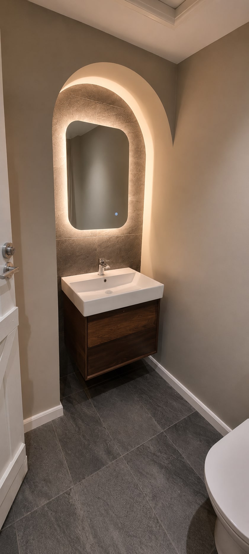 A Calm Greige Bathroom with Arched Vanity After