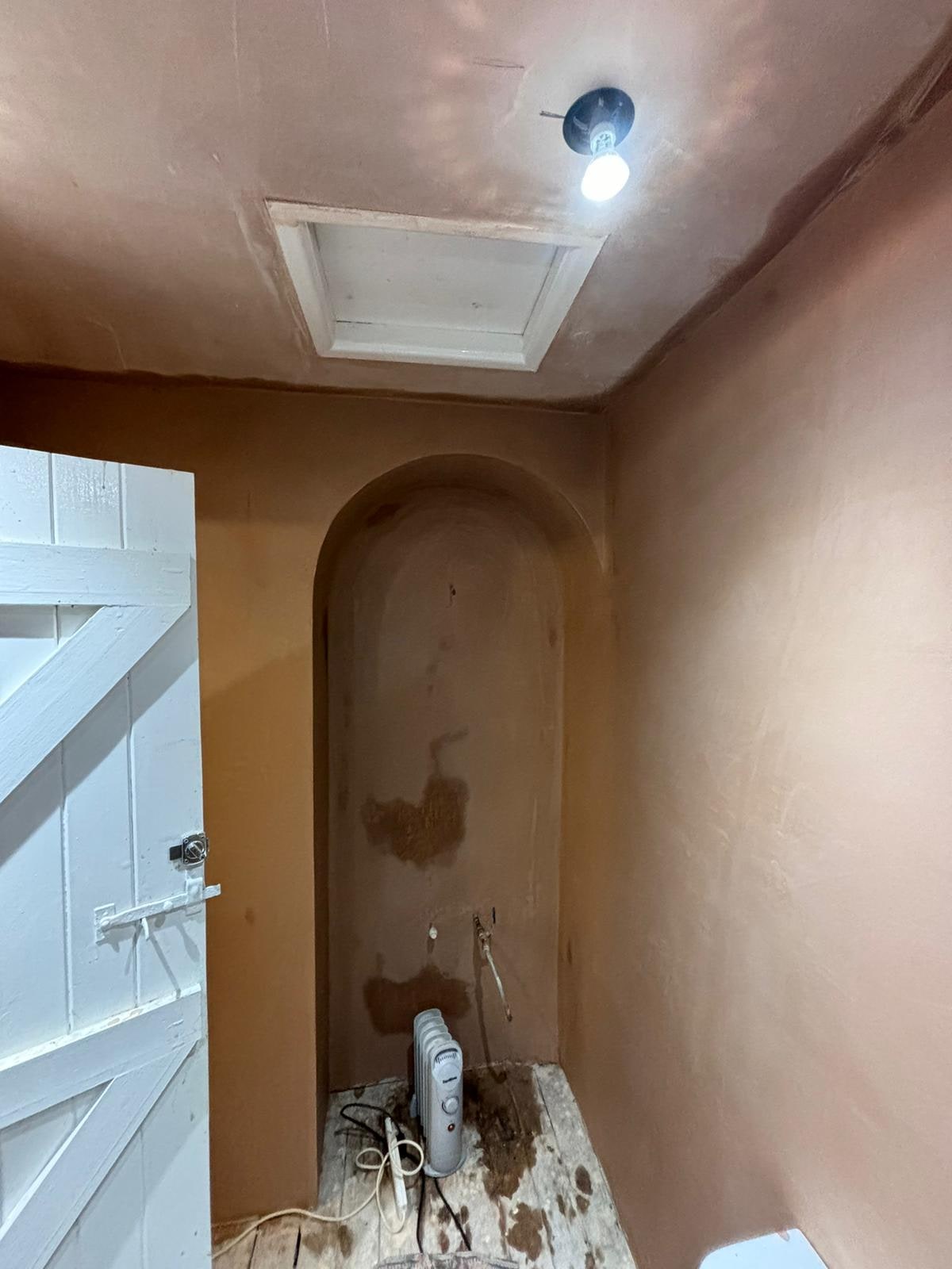 A Calm Greige Bathroom with Arched Vanity Before