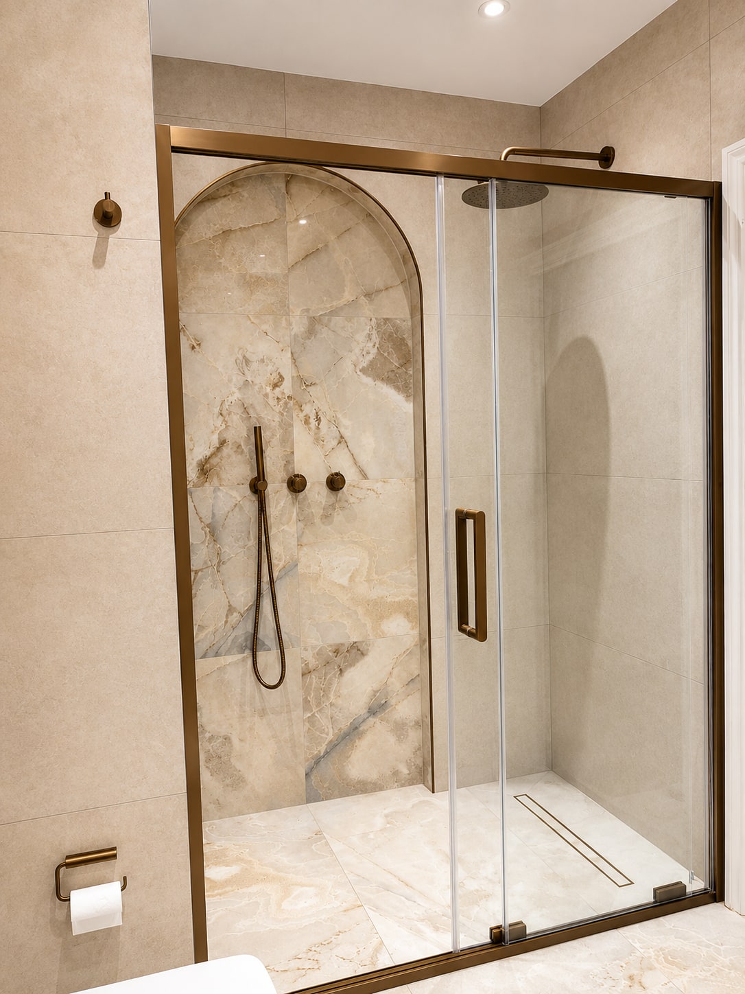 A Period Bathroom Reborn in Stone & Bronze After
