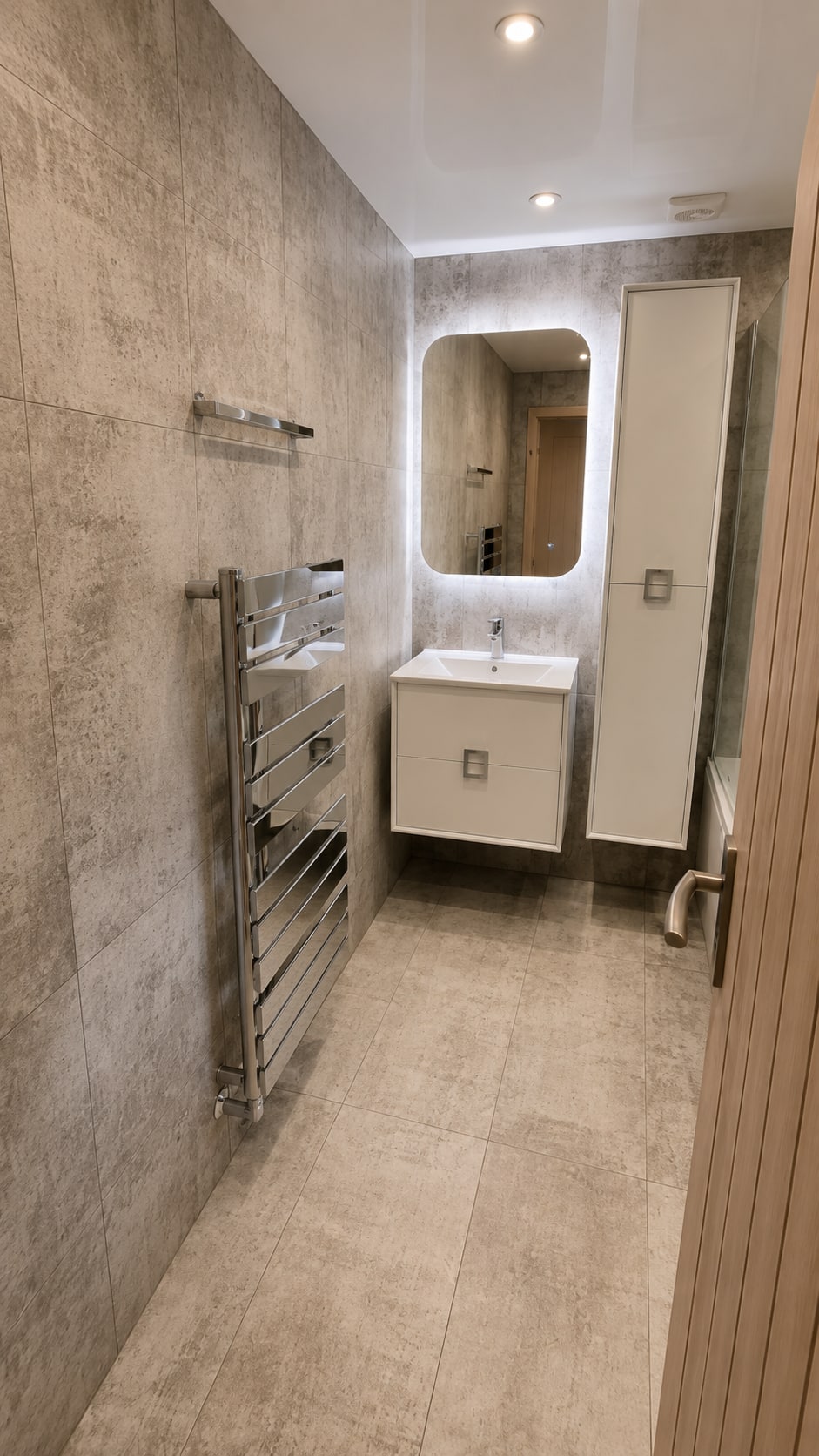 Warm Concrete & Oak Family Bathroom — Concrete-effect microcement, oak accents, shower-bath family bathroom by Bright Bathrooms, Greater Manchester