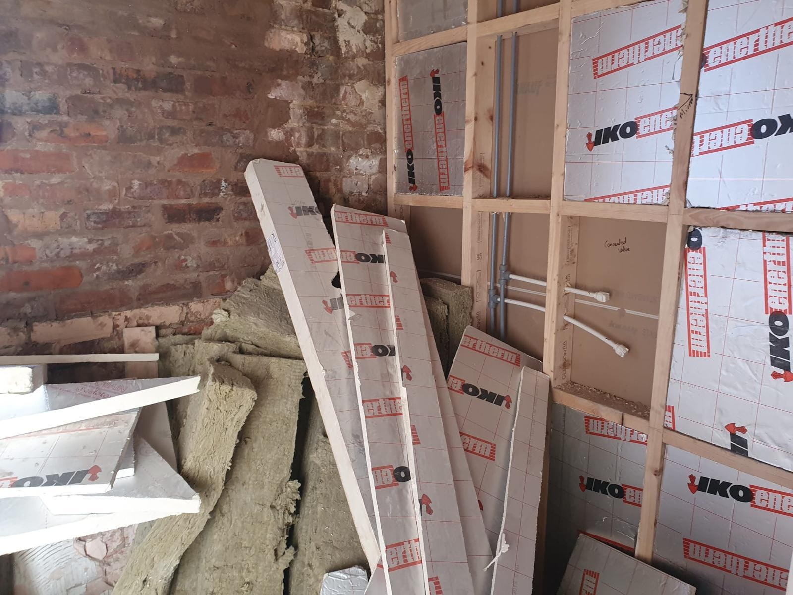 A Period Bathroom Reborn in Stone & Bronze Before