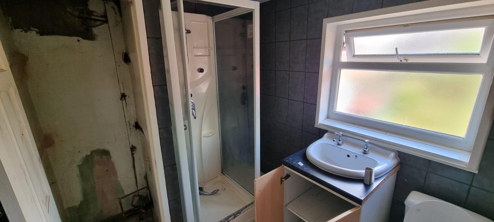 Warm Concrete & Oak Family Bathroom Before