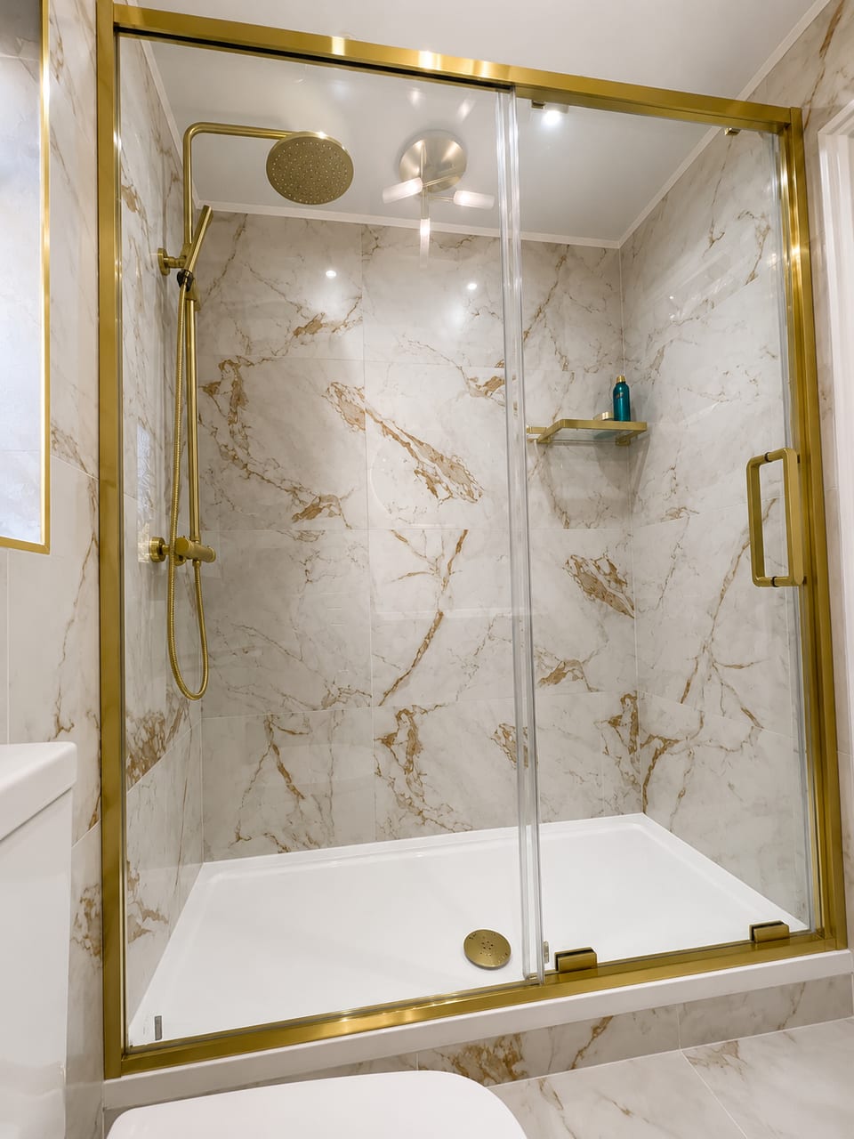 Calacatta Marble & Gold Shower Room — Calacatta marble-effect & brushed gold shower room by Bright Bathrooms, Greater Manchester