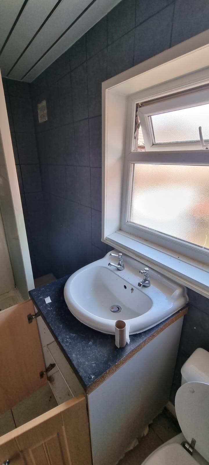 Warm Concrete & Oak Family Bathroom Before