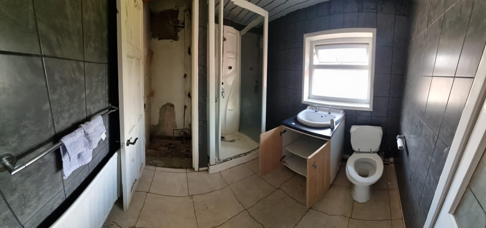Warm Concrete & Oak Family Bathroom Before